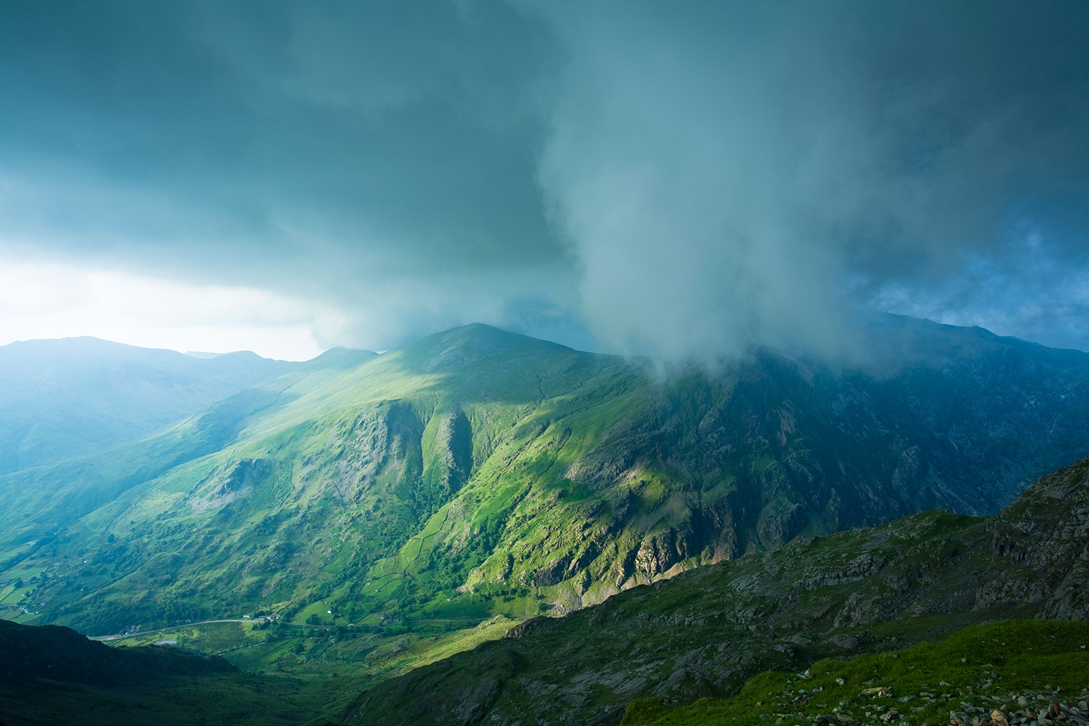 Storm clouds rolling in over Glyder Fawr, Snowdonia, Wales, 06/2009. Credit: Nature Photographers Ltd/Alamy Stock Photo.
